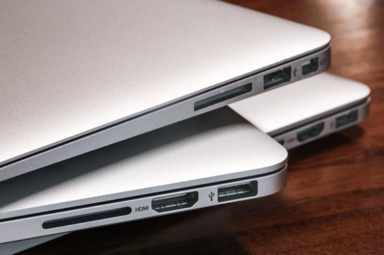 Stack of Mac Book Laptops